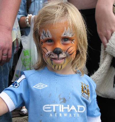 Child with painted face at the Moorcock's fundraising day