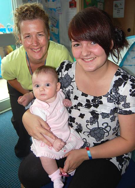 Lauren Sutton from Rochdale with baby daughter, Amelia, and Community Nursery Nurse, Julie Pickles