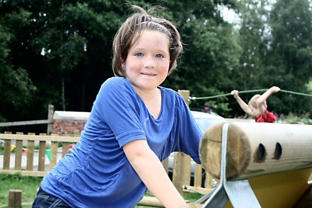 Child enjoys climbing frame