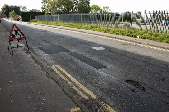 Repaired potholes on Royle Barn Road