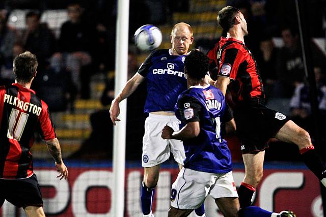 Rochdale 3 - 0 Huddersfield<br>Jason Kennedy battles with Jamie McCombe as Chris O'Grady watches