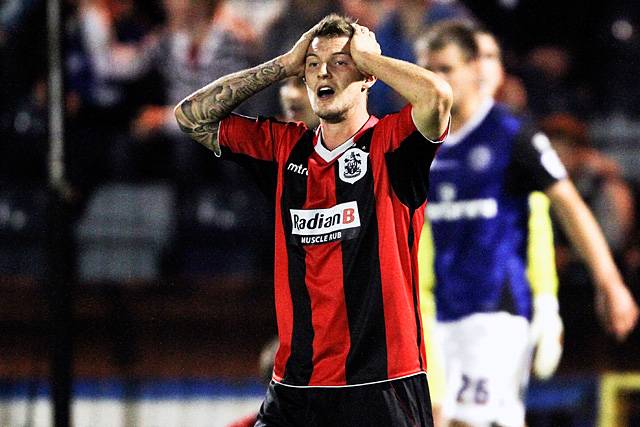 Rochdale 3 - 0 Huddersfield<br>Anthony Pilkington holds his head in despair