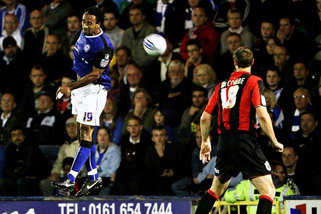 Rochdale 3 - 0 Huddersfield<br>Chris O'Grady dominating in the air while Jamie McCombe watches on