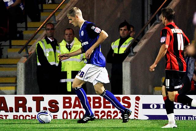 Rochdale 3 - 0 Huddersfield<br>Matthew Flynn with Anthony Pilkington chasing