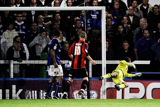 Rochdale 3 - 0 Huddersfield<br>Josh Lillis tips a Huddersfield effort round the post