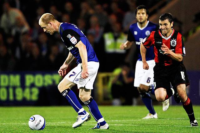 Rochdale 3 - 0 Huddersfield<br>Jason Kennedy with Damian Johnson in pursuit