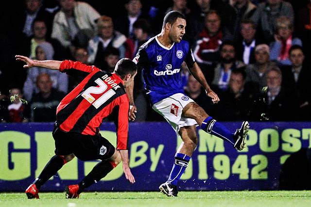 Rochdale 3 - 0 Huddersfield<br>Marcus Holness clears with Lee Novak close by