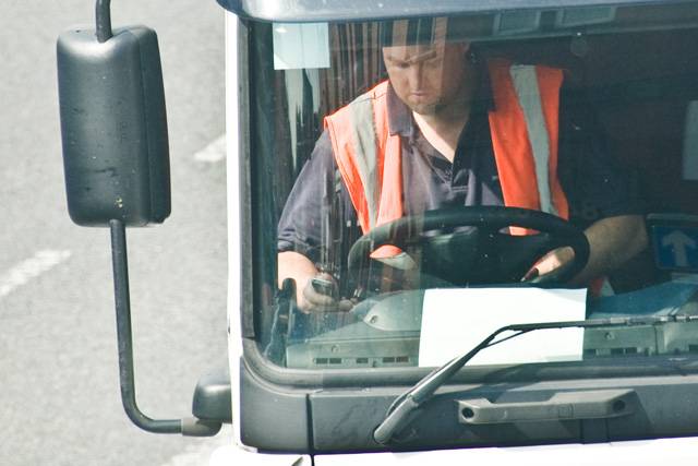 One driver appears to be sending a text message whilst driving a lorry