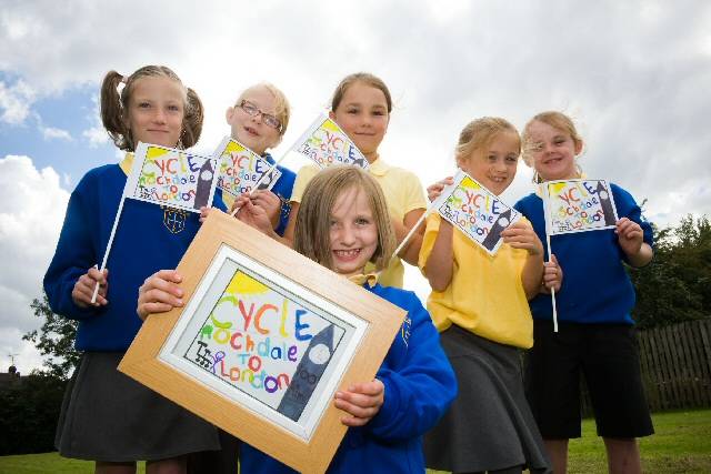 Lucy and her friends celebrate with the winning flag design 
