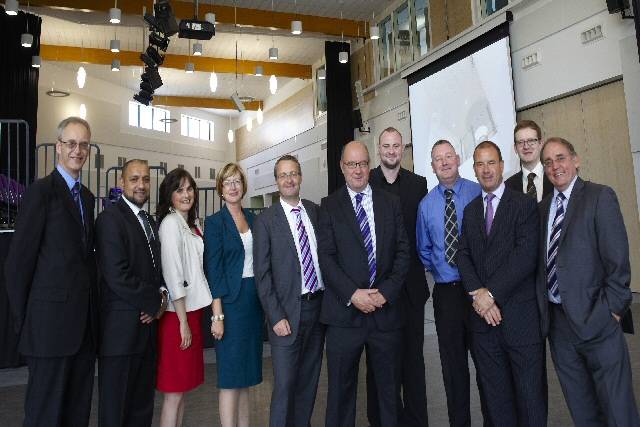 Outgoing Principal Eric Jackson (centre) with representatives from Willmott Dixon

