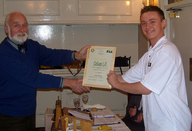 Calum Lill receives his award from John Pedley from the Rotary Club of Middleton. 