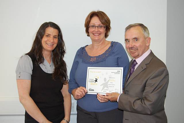 David Edwards, Acting Chairman, presents Alison Hand with her Going for Gold Stars award