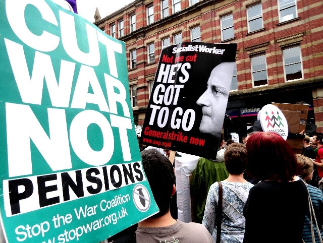 Members of the Peace Group with a 'Cut War not Pensions placard in the march 