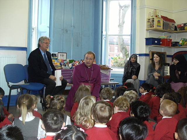 Bishop Mark talks to the Nursery pupils at Harvest Festival
