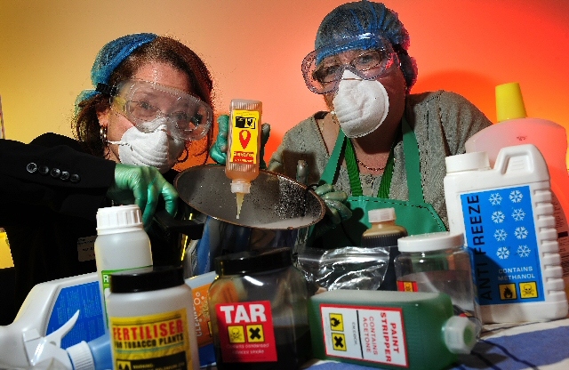 Mary Wallace, Trainer, shows Bev Maguire of Belfield Children’s Centre, Rochdale just what kind of chemicals a cigarette contains.
