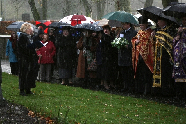 Members of the community braving the rain for the service