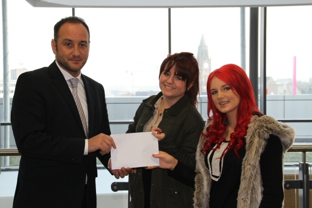 Julian Appleyard, College Principal, presents the prize to Lauren Carey and Paula Lyons