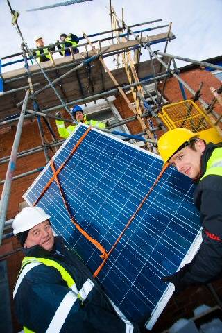 Arthur Cranfield (left) and Alan Ronan get to grips with the solar panels
