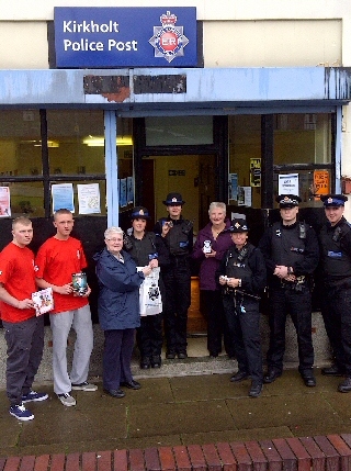 Kirkholt officers with Councillor Colclough, Fire Service volunteers and local resident Sheila Noakes outside the police post.
