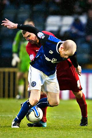 Rochdale 1 - 1 Leyton Orient<br \> Jason Kennedy staves off a challenge from Stephen Dawson