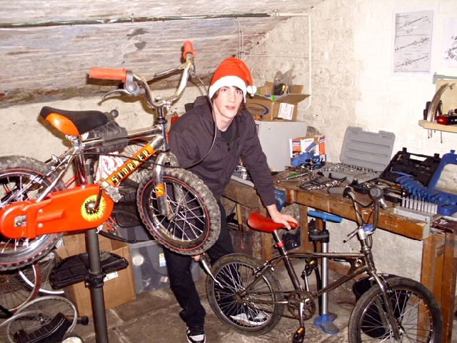 Toby Werhun, volunteer, with some of the bikes that are being brought back to life