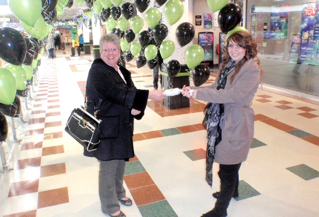 Two shoppers pulling a cracker