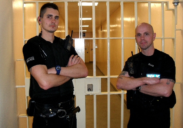 PCs Steven Raczkowski and Jason Aulton in front of the cells at Bury