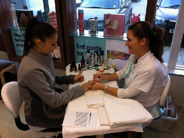 A customer enjoys a manicure at the new-look Co-operative Pharmacy in the Cutgate Shopping Centre. 
