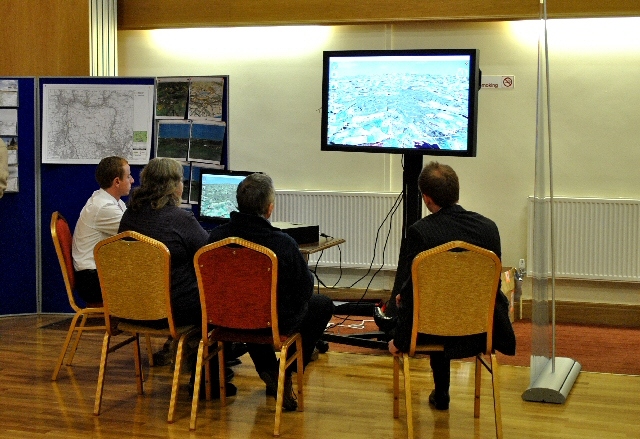 Visitors viewing an interactive 3D representation of the wind farm expansion