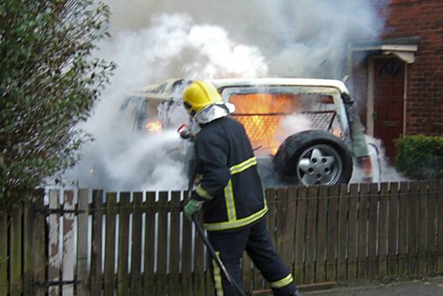 A fire-fighter putting the fire out