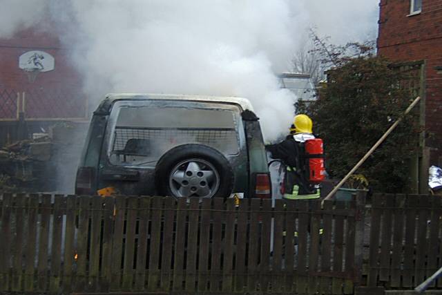 Car fire on Delamere Road, Turf Hill, being extinguished by the firse service