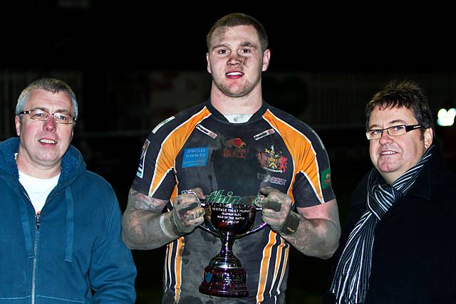 Oldham Roughyeds v Rochdale Hornets - Law Cup Final: Man of the match: Ben Wood, pictured with Steve Brown (left) and Chris Hamilton (right), picks up the Heritage Trust Trophy after scoring a hat-trick