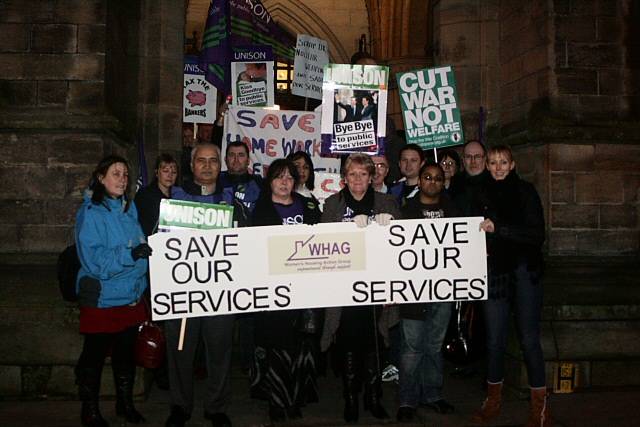 People gathered outside the Town Hall with placards