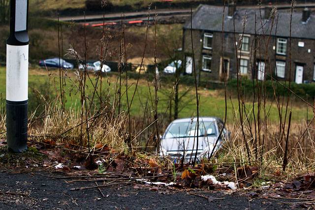 The driver of this car had a lucky escape after swerving on Huddersfield Road, Newhey, and down a steep bank
