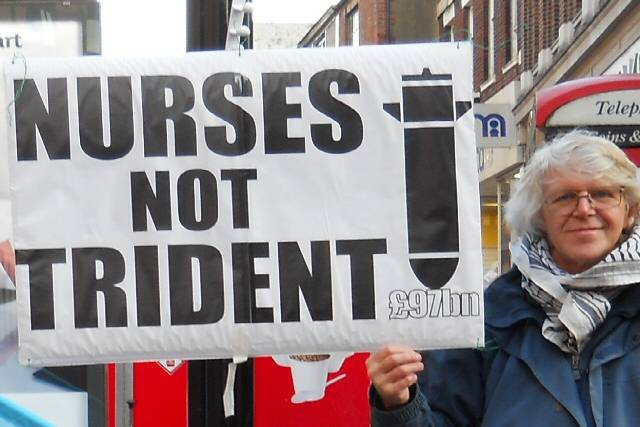 Philip Gilligan with a 'Nurses Not Trident' placard in Yorkshire Street 