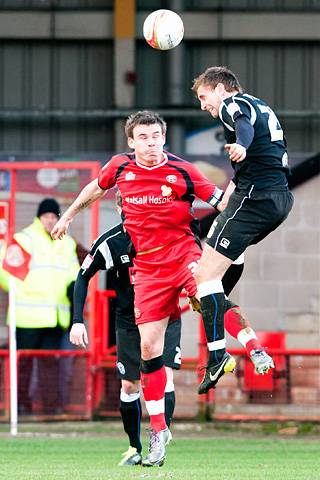 Walsall 0 - 0 Rochdale<br \>Craig Dawson beats Andy Butler in the air
