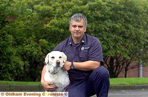 Echo the labrador with his handler fire-fighter Mike Dewar