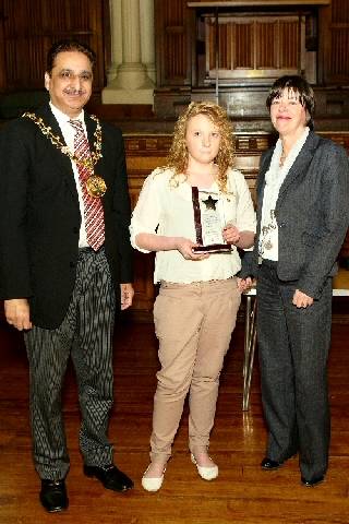 Young person of the year, Rebecca Ashwell, with the Mayor and Cheryl Eastwood, Executive Director for Children, Schools and Families at Rochdale Borough Council.
