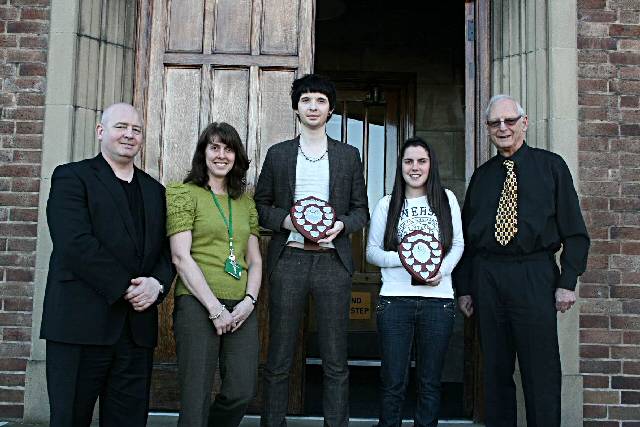 Grant and Samantha receiving their awards from Henry West MBE with principal Derek O’Toole and Yvonne Farrand  
