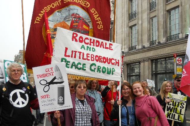 The group in action: Philip Gilligan, Patricia Gilligan, Jenny Turner, Pauline Devine and friends with the peace group banner leaving Trafalgar Square on Saturday 26 March 2011.