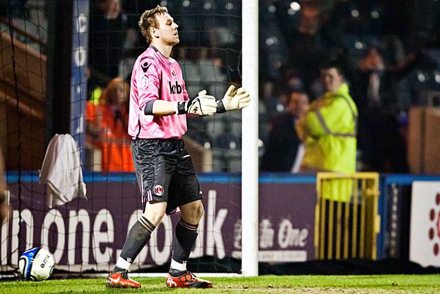 Rochdale 2 - 0 Charlton Athletic<br />Charlton keeper Rob Elliot is rooted to the spot as Jason Kennedy's long range drive passes him