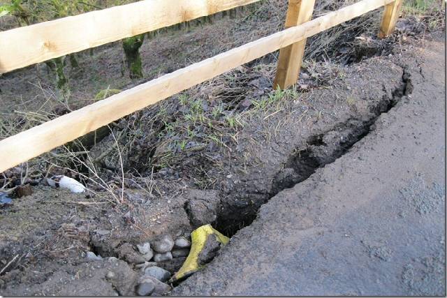 A close-up of the road where it is being eroded by the wet weather