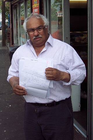 Mr Janjua holding his resignation letter