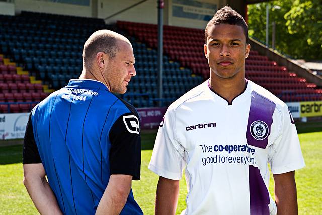 Gary Jones and Joe Thompson model Rochdale AFC's new home and away kits