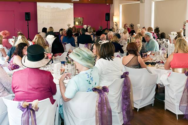 Guests watch the Royal Wedding on the big screen at the Bella Vista