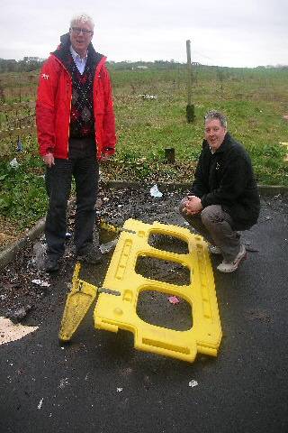 Councillor Dale Mulgrew and Paul Rowen pointing out the mess on Lower Lane, in April