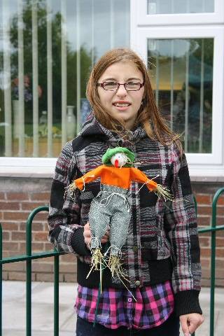 Natasha Donald shows off her scarecrow