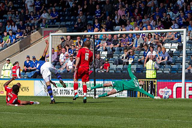 Rochdale 2 - 2 Peterborough United<br />Joe Thompson's shot is saved by Joe Lewis