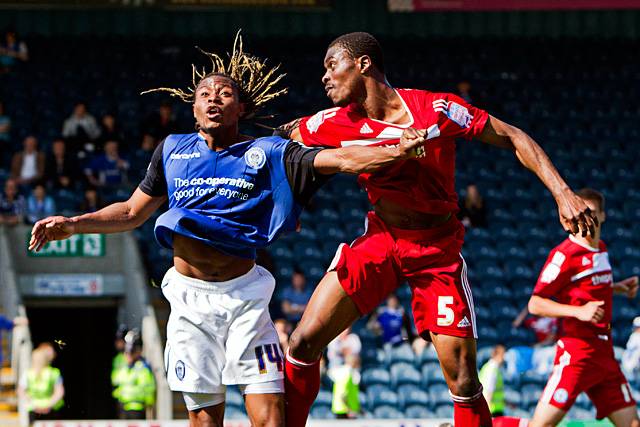 Rochdale 2 - 2 Peterborough United<br />Jean Louis Akpa-Akpro loses the header but wins the best hairstyle competition!