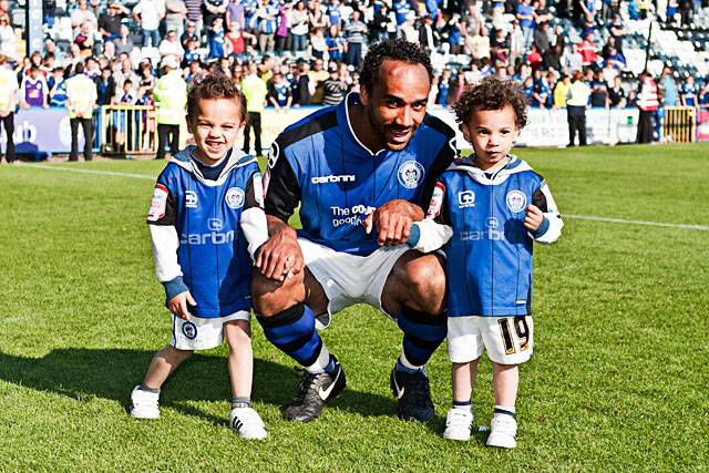 Chris O'Grady with his children on the lap of honour